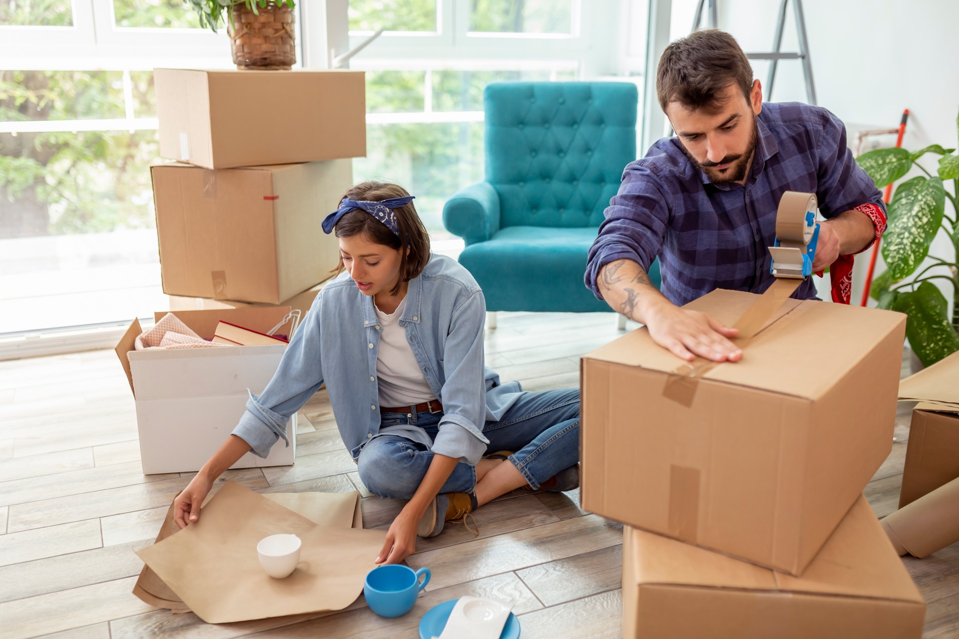 Couple moving house, packing things